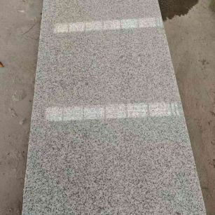 金昌芝麻白光面毛板